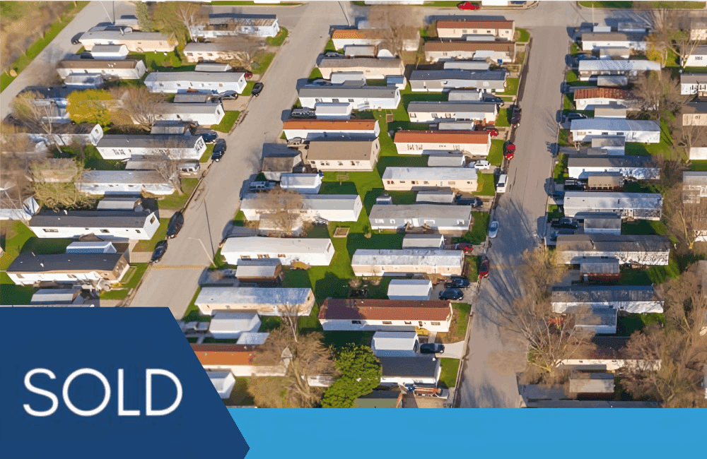 Aerial mobile home park with SOLD banner