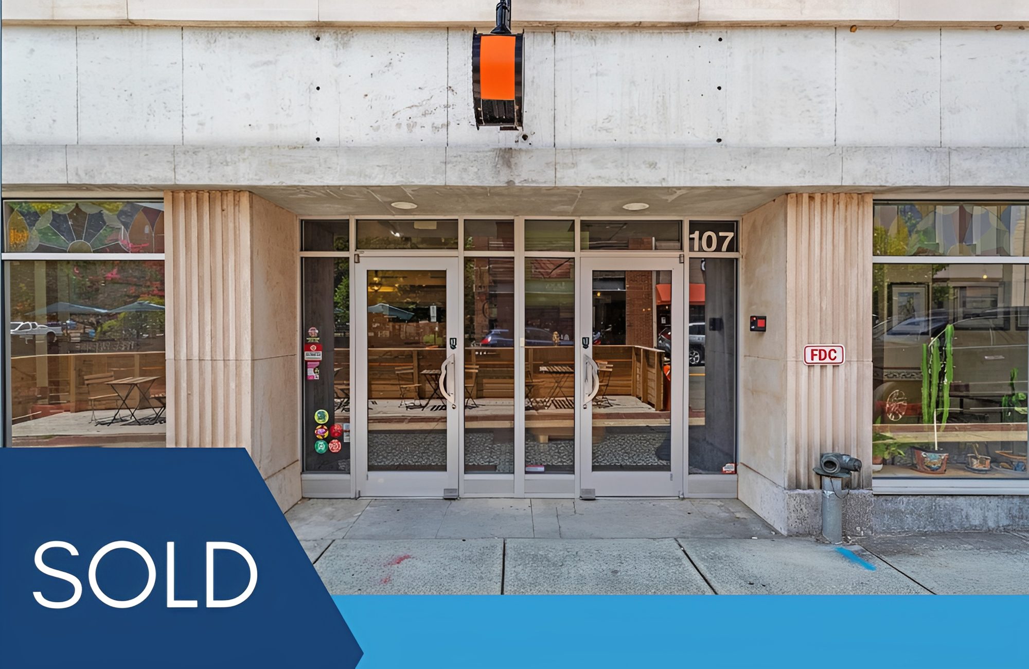 Storefront with "SOLD" label on image.